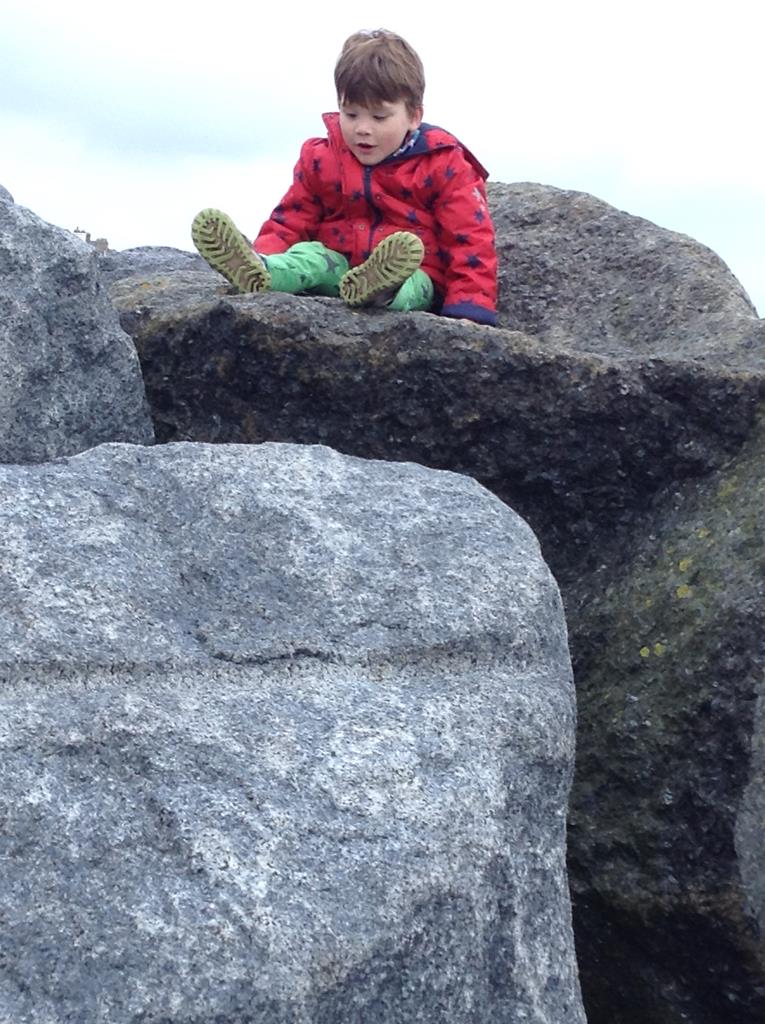 boy on the rocks