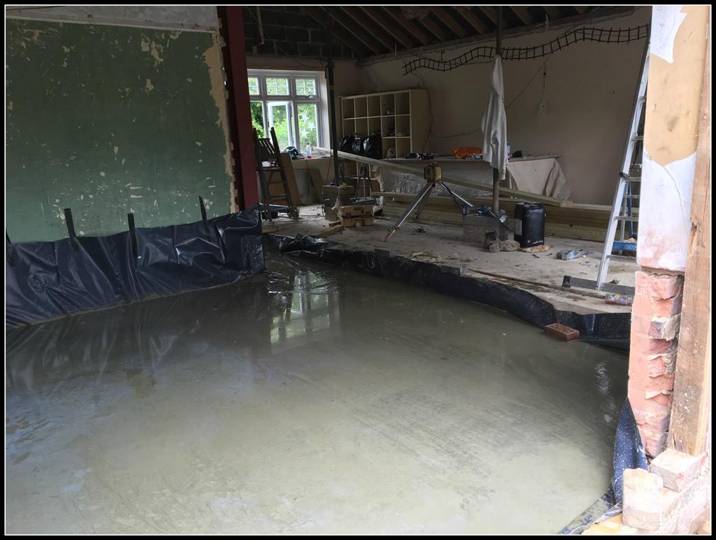 Looking from the kitchen to lounge and dining space