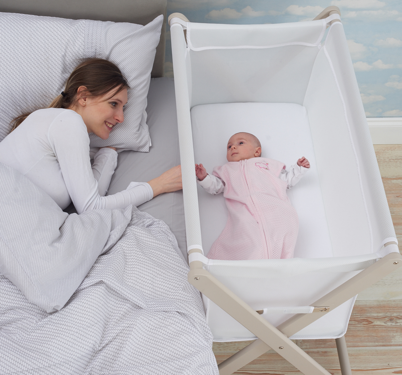 Mum and baby in crib